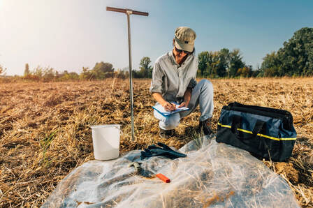 Soil scientist testing property for septic system locationPicture