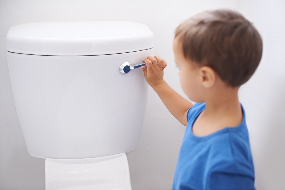 Child flushing toilet