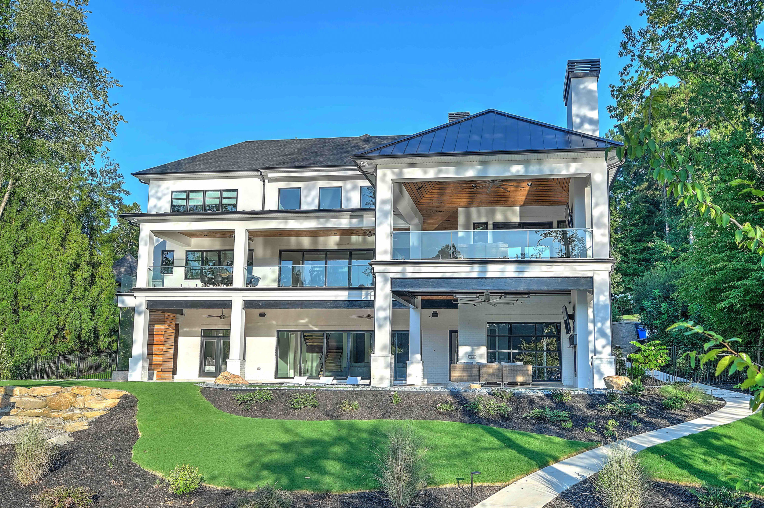 Custom Lake Home Covered Porches Large Sliding Glass Walls Excellent Lake Views Outdoor Fireplaces Lounge Putting Green