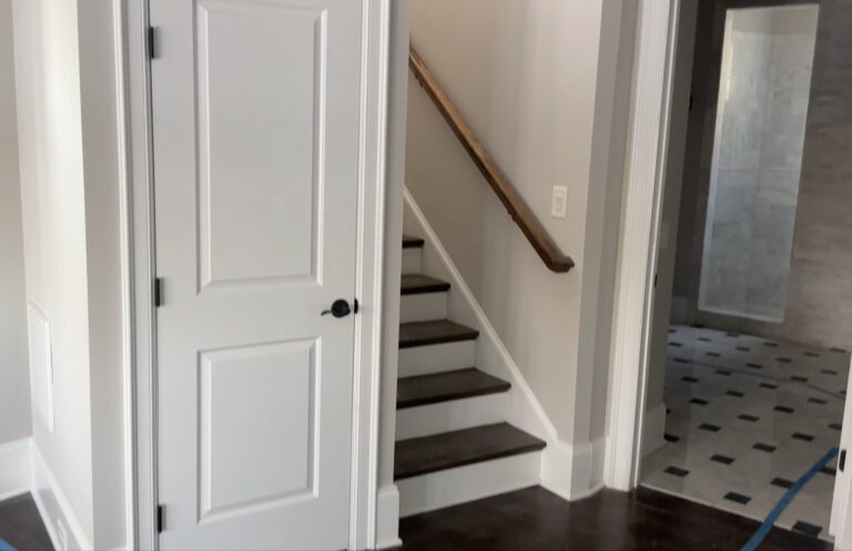 before stairwell in bedroom